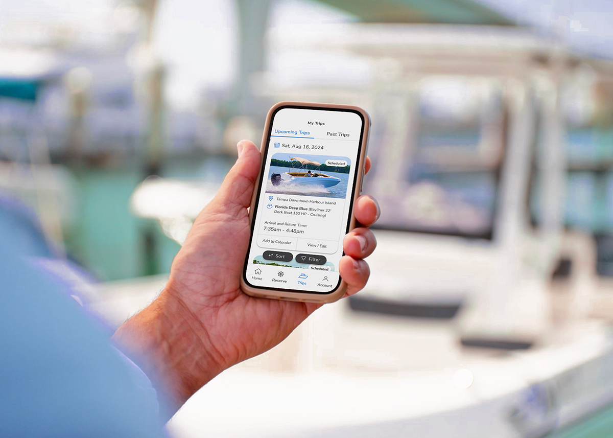 man reserving boat on phone